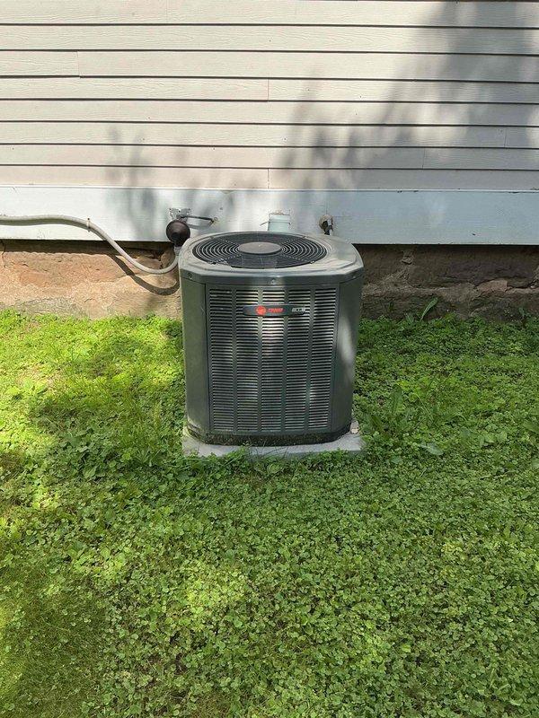 # HVAC Maintenance Agreement - Tune Up Service

Completed comprehensive air conditioning tune-up service on residential outdoor condenser unit. Performed thorough cleaning of outdoor unit coils and components, replaced air filter, and conducted complete system testing of all electrical components and mechanical operations. During final equipment testing, identified thermostat failure requiring replacement or repair. Documented equipment condition with photographs of unit make, model, and serial number information per service protocol.