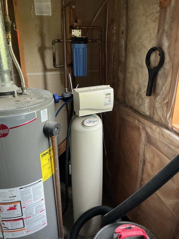 Performed comprehensive AC tune-up on 6-year-old system. Conducted full system inspection beginning with indoor unit, checking air filter which was found to be heavily soiled; homeowner will replace filter independently within the week. Verified evaporator drain line was clear and draining properly, confirmed blower motor speeds were correctly configured for system specifications. 

Proceeded to outdoor condensing unit and performed electrical component inspection. Tested capacitor which measured within manufacturer specifications, verified contactor showed no signs of pitting or wear. Removed top panel and pressure-washed condenser coils to remove accumulated debris and restore heat transfer efficiency. Reassembled unit and initiated startup sequence, allowing system to run for 15-minute operational test. Measured supply and return air temperatures confirming 19-degree temperature differential, indicating proper refrigerant charge and system performance. All components operating as de