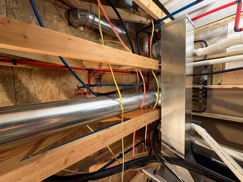 Completed comprehensive plumbing inspection as part of recurring maintenance program. Inspected water heater and identified corrosion at base of unit with rust staining on surrounding concrete floor, indicating potential leak or age-related deterioration requiring monitoring. Documented all plumbing systems, HVAC ductwork, and utility infrastructure throughout mechanical spaces to ensure proper operation and identify any maintenance concerns.