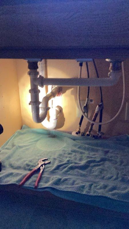 Completed plumbing repairs on duplex property addressing multiple fixtures. Replaced toilet internal components including fill valve and flush seal in bathroom, resolving flushing malfunction. Snaked clogged kitchen sink drain to restore proper drainage. All fixtures tested and confirmed operational upon completion.