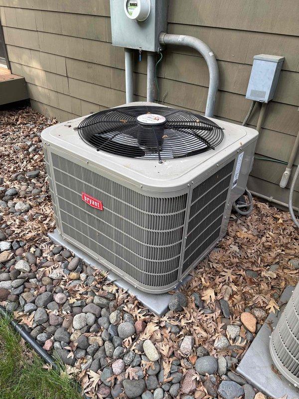 Completed annual preventive maintenance on two Bryant air conditioning systems with R-410A refrigerant. Performed comprehensive inspection of both condensers including filters, thermostats, temperature splits, condenser coils, motors, capacitors, compressors, refrigerant levels, and condensate drains. All components tested within normal operating parameters with ambient temperature at 58 degrees. Additionally replaced humidifier pad per homeowner request. Both systems confirmed operational and ready for cooling season.