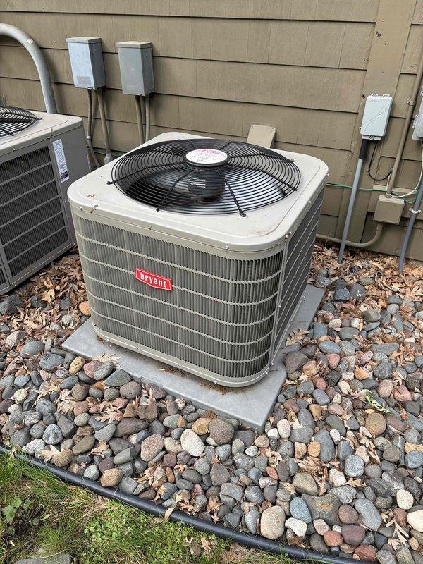 Completed annual preventive maintenance on two Bryant air conditioning systems with R-410A refrigerant. Performed comprehensive inspection of both condensers including filters, thermostats, temperature splits, condenser coils, motors, capacitors, compressors, refrigerant levels, and condensate drains. All components tested within normal operating parameters with ambient temperature at 58 degrees. Additionally replaced humidifier pad per homeowner request. Both systems confirmed operational and ready for cooling season.