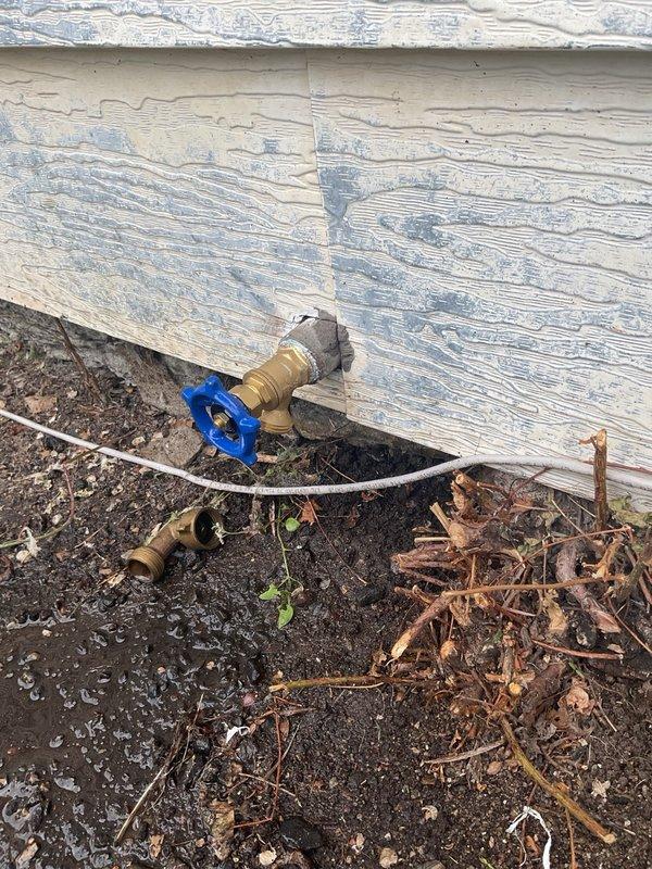 Responded to service call for broken external water spigot at rental property. Upon arrival, found the outdoor faucet handle had broken threads and was inoperable. Replaced the damaged boiler-style faucet with new unit, restoring full functionality to the exterior water supply connection.