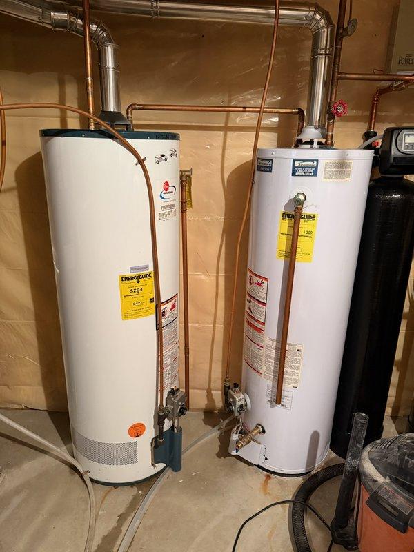 Conducted on-site evaluation of two existing water heaters in basement utility area, with one unit actively leaking. Assessed current plumbing configuration, including copper supply lines, relief valves, and venting system connections. Documented existing installation setup and provided estimate for replacement with single 80-gallon water heater unit to consolidate system and resolve leak issue.