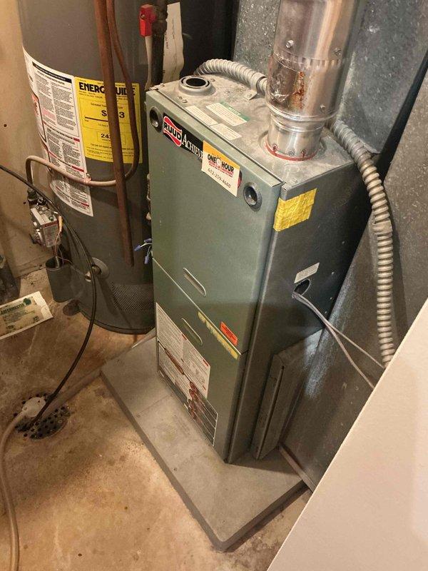 Completed annual cooling tune-up on 15-year-old Ruud AC system. Identified weak capacitor on compressor side, pressure fluctuations of 20psi indicating non-condensibles in refrigerant system, high compressor startup amp draw, and low temperature drop of 15 degrees. Replaced furnace filter, verified evaporator coil is clear, confirmed contactor and control board are functioning properly, and refrigerant charge is adequate. Discussed findings and repair options with homeowner and scheduled follow-up service advisor visit.