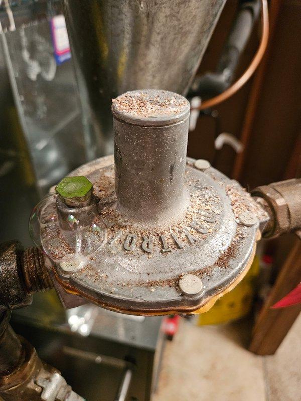 Responded to gas leak call at residential property. Upon inspection, identified leaking regulator vent as source of gas leak. Replaced faulty regulator to eliminate leak and restore safe operation of gas system. System tested and confirmed leak-free upon completion.