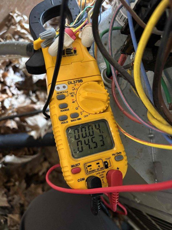 Completed annual cooling maintenance on two R-410A air conditioning systems with ambient temperature at 67 degrees. Performed comprehensive inspection and testing of all major components including filters, thermostats, temperature splits, condensers, coils, motors, capacitors, compressors, refrigerant levels, and condensate drains. Both units operating within normal parameters at time of service. Diagnosed malfunctioning zone damper creating excessive clicking noise due to mechanical binding. Provided estimates for zone damper replacement and capacitor replacement; property owner declined repairs at this time.