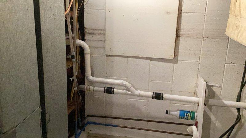 Completed kitchen sink drain repipe by removing existing drain piping and installing new PVC drain line from the kitchen sink through to the basement level. Connected the new drainage system to existing PVC piping in the basement, tied into the existing vent stack, and installed an Air Admittance Valve (AAV) to ensure proper drainage and venting. All connections were secured with appropriate couplings and fittings, and the system was tested for proper flow and leak-free operation.