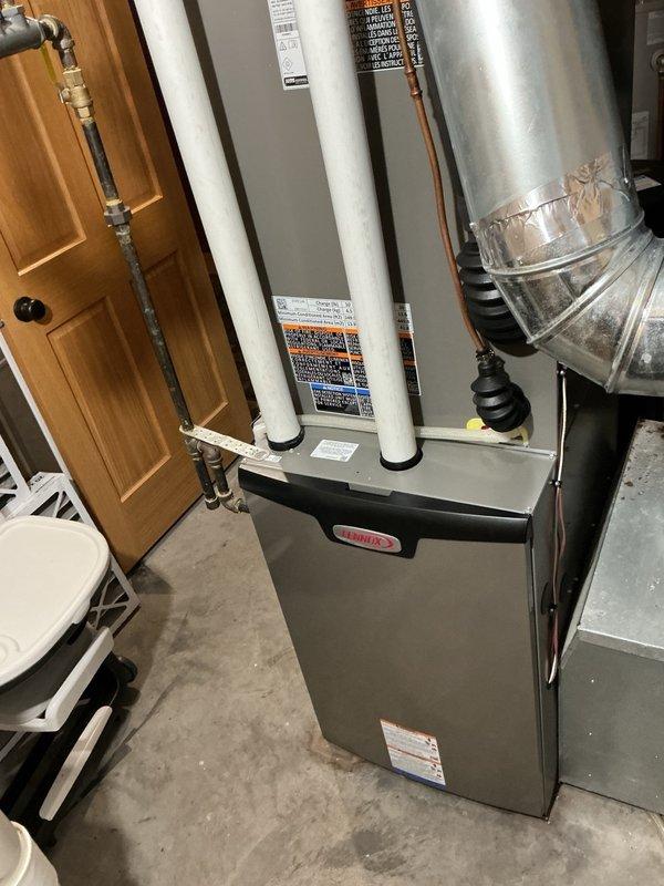 Completed annual AC maintenance tune-up on Lennox system under Family Rewards agreement. Performed comprehensive inspection including filter check (recently replaced), evaporator coil flush, condensate drain cleaning, and blower speed verification. Removed outdoor unit panels, rinsed condenser coil, and inspected all electrical connections and components—all found clean and properly configured. System startup test confirmed optimal performance with 22° temperature differential after 15-minute run cycle.