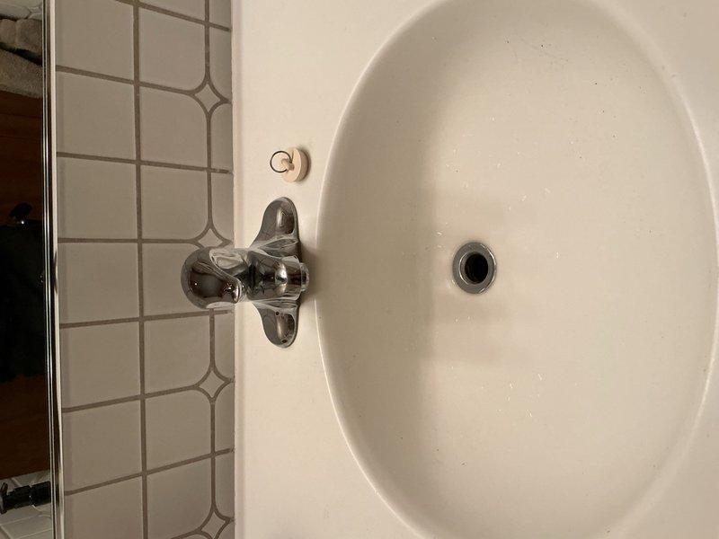 Responded to water leak in mechanical room. Upon inspection, identified the source as a leaking temperature and pressure relief valve on the boiler. Released excess pressure from the system and shut off the automatic fill valve to stop the leak. Additionally, installed a new sink faucet and drain assembly in the bathroom to replace the broken pop-up drain stopper. Advised homeowner that the auto fill valve remains off and recommended scheduling a follow-up appointment upon return from vacation to verify the floor remains dry and complete replacement of the auto fill valve if necessary.