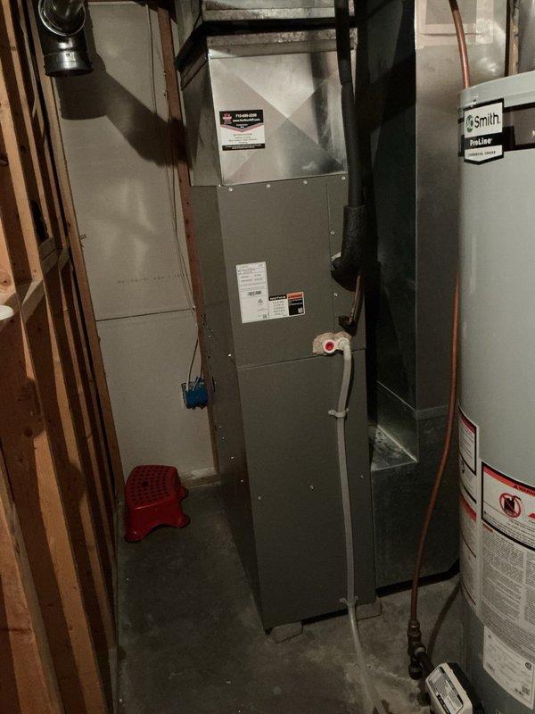 Completed Family Rewards cooling maintenance visit on residential AC system. Removed access panels and thoroughly rinsed condenser coils which were significantly plugged with debris. Performed electrical inspection with all connections and components found in good working order. Verified indoor air filter had been recently replaced. Confirmed evaporator drain line was draining properly with no blockages. Checked airflow and thermostat settings, all within proper parameters. Started system and monitored operation, confirming proper cooling performance with 20-degree temperature split across the coil.