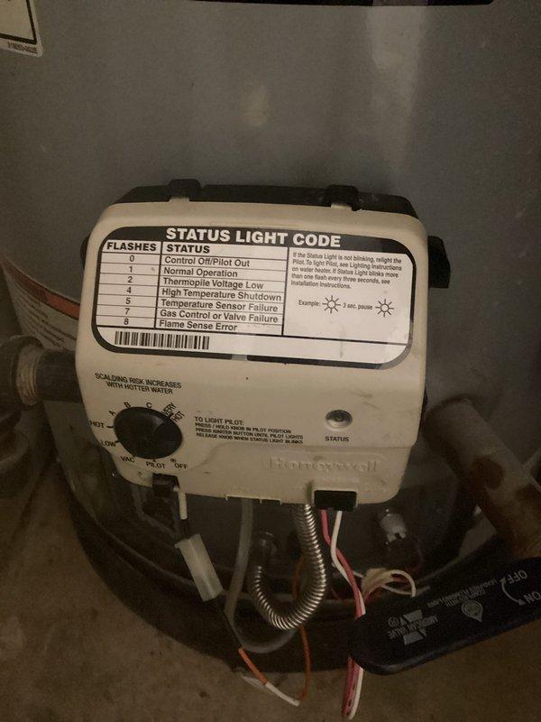 Responded to no hot water complaint on 10-year-old American ProLine tanked water heater. Diagnosed pilot light failure where flame would ignite when button depressed but immediately extinguished upon release. Tested thermopile output and measured 700mv DC, which indicated adequate thermocouple function. Determined Honeywell gas control valve was faulty and preventing pilot from remaining lit despite proper thermopile voltage. Provided estimate for gas valve replacement versus full water heater replacement and awaited approval for repair.