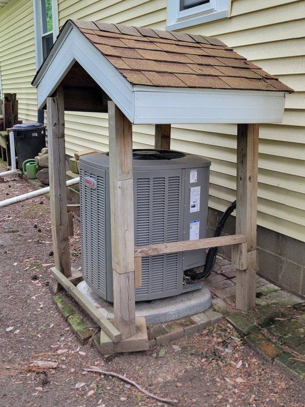 Completed comprehensive AC tune-up including full system inspection of indoor and outdoor units. Addressed homeowner concern regarding rattling noise from outdoor unit by rinsing condenser coils, inspecting electrical components, and identifying loose fan cover which was resecured to eliminate noise. Verified evaporator drain line draining properly and confirmed system operating efficiently with 22° temperature split across evaporator coil. Noted air filter overdue for replacement (over one year) and advised homeowner to replace soon for optimal system performance.