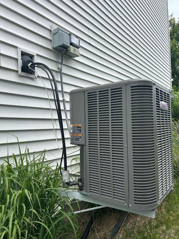 Completed comprehensive AC tune-up and maintenance inspection on 8-year-old Lennox system with no known issues. Performed thorough evaluation including thermostat calibration, filter assessment, blower assembly inspection, outdoor condenser coil examination, electrical component testing, contactor and capacitor verification, condensate drain check, refrigerant charge analysis, and temperature split measurements. All system parameters and readings measured within manufacturer specifications with no mechanical defects, safety concerns, or performance issues identified. Verified proper operation of outdoor condensing unit with cylindrical design, refrigerant line connections, and electrical disconnect. Inspected indoor furnace installation including PVC venting, gas line connections with pressure regulator, and copper refrigerant lines. System operating efficiently and reliably. Advised continued regular filter replacement, maintaining clean indoor and outdoor coils, and scheduling routin