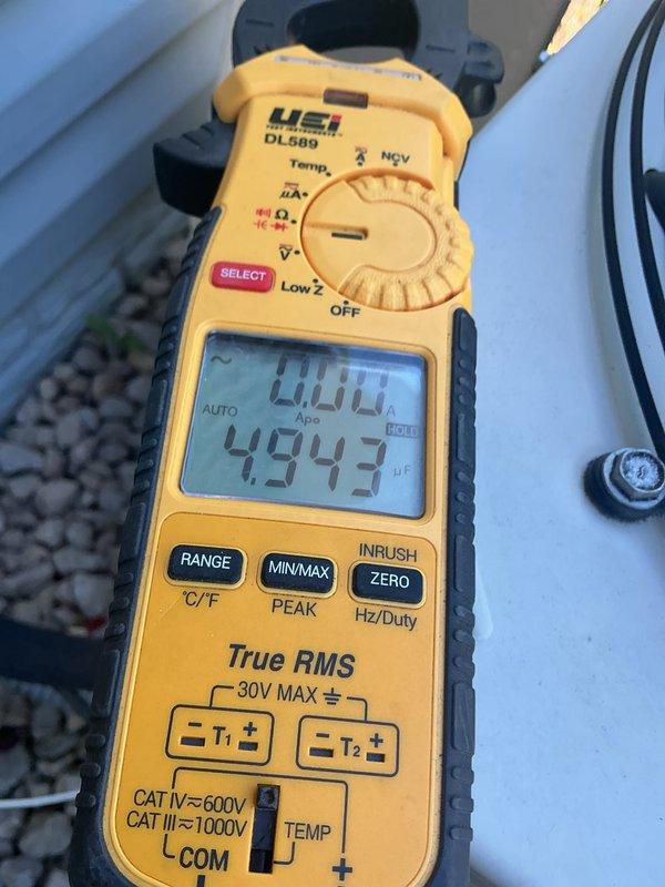 Completed annual AC maintenance on 21-year-old R22 system. During inspection, discovered dual capacitor reading out of specification and contactor showing significant pitting on contact points. Replaced defective dual capacitor and contactor to restore proper system operation and prevent potential failure.