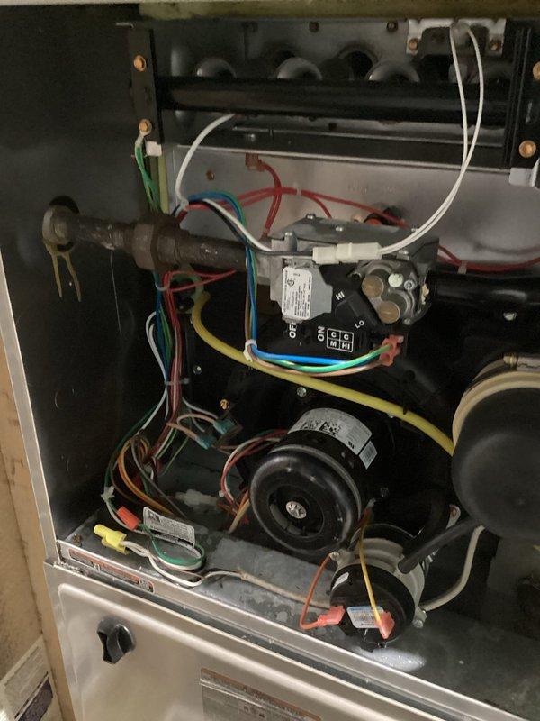 Performed warranty inspection on residential furnace system following previous diagnostic visit. Confirmed heat exchanger failure through visual inspection and documentation. Accessed internal components by removing furnace cabinet panels to examine burner assembly, gas valve, heat exchanger surfaces, and blower motor assembly. Captured detailed photographic documentation of failed heat exchanger and overall unit condition showing internal wiring, gas connections, and mechanical components. Submitted warranty claim information and technical documentation to parts department for manufacturer review and heat exchanger replacement authorization under existing warranty coverage.