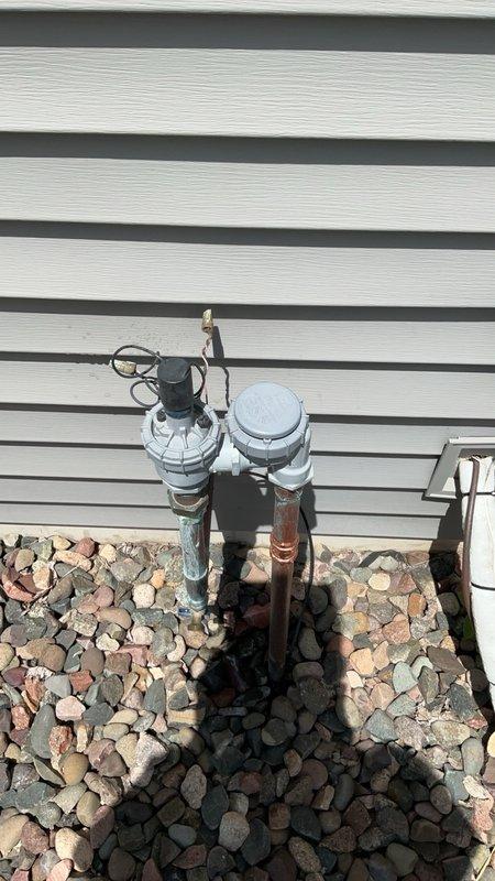 Responded to water leak complaint affecting interior of home. Upon inspection, identified leak originating from irrigation line at the pressure vacuum breaker (PVB) assembly located on building exterior. Documented condition with photographs showing corroded piping and PVB components. Submitted parts order request to prepare replacement estimate for damaged irrigation system components.
