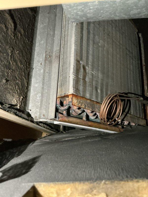 Performed AC tune-up on 28-year-old system and identified multiple critical issues requiring immediate attention. System found to be slightly low on refrigerant with 25-degree superheat and 30-degree vapor saturation readings, indicating potential leak that could cause coil freezing and condensation damage to interior ceiling/floor. Compressor operating at high amperage levels, confirming imminent failure. Capacitor had been recently replaced by previous service. Installed 16x20x1 filter during maintenance. Due to age of equipment and compressor failure, recommended complete system replacement and scheduled estimate for new AC installation.