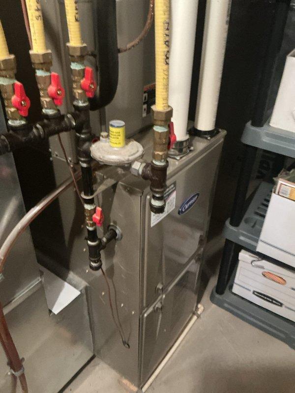 Responded to no heat call on 13-year-old furnace system. Upon arrival, found draft inducer motor dragging and drawing over full load amperage. Manually spun motor to verify mechanical binding, confirmed motor failure when unit attempted to run. Replaced defective draft inducer motor and restored system to proper operation.