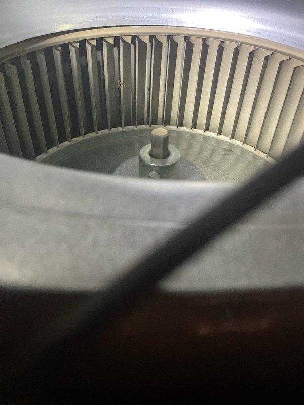 Responded to no heat call on 13-year-old furnace system. Upon arrival, found draft inducer motor dragging and drawing over full load amperage. Manually spun motor to verify mechanical binding, confirmed motor failure when unit attempted to run. Replaced defective draft inducer motor and restored system to proper operation.