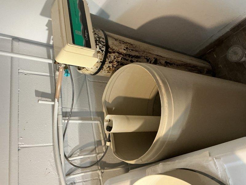 Responded to laundry room water leak caused by a non-functioning water softener that had been shut off for approximately one year. Removed the defective water softener unit and associated drain connections by cutting out the existing plumbing configuration. Reconnected and restored direct water flow to the house by bypassing the softener system, ensuring proper water supply throughout the residence.