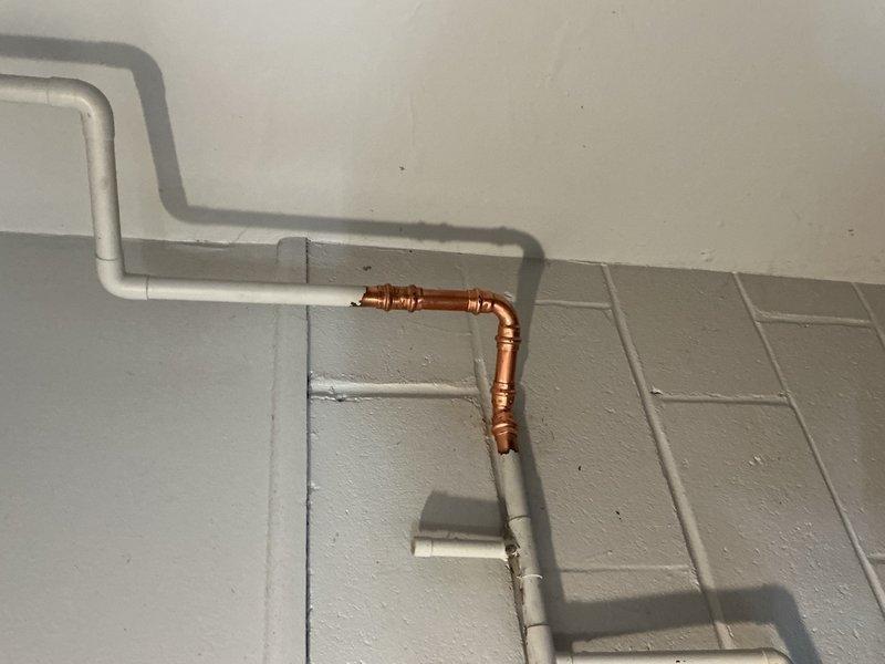 Responded to laundry room water leak caused by a non-functioning water softener that had been shut off for approximately one year. Removed the defective water softener unit and associated drain connections by cutting out the existing plumbing configuration. Reconnected and restored direct water flow to the house by bypassing the softener system, ensuring proper water supply throughout the residence.