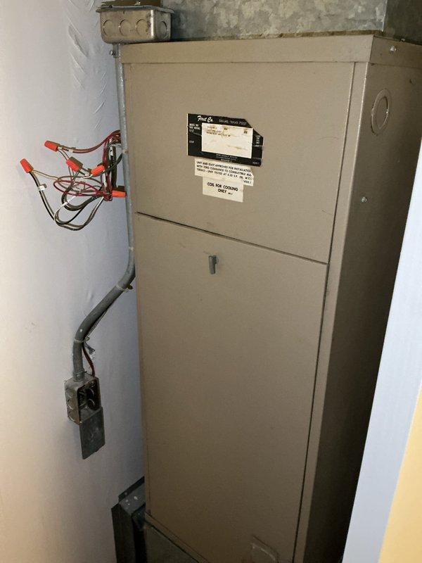 Performed comprehensive AC tune-up on 28-year-old rooftop unit accessed via front desk key coordination. System inspection revealed multiple failing components including capacitor, contactor, and condenser fan motor operating outside specifications. Compressor drawing high amperage and lineset insulation deteriorated, causing reduced efficiency and increased system workload. Unit operates on obsolete R22 refrigerant. Documented all failing components with photographic evidence showing electrical panel connections, outdoor condensing unit, and degraded pipe insulation on pebbled rooftop surface. System remains operational but requires replacement of capacitor, contactor, condenser fan motor, and lineset insulation to restore proper efficiency and prevent imminent failure.