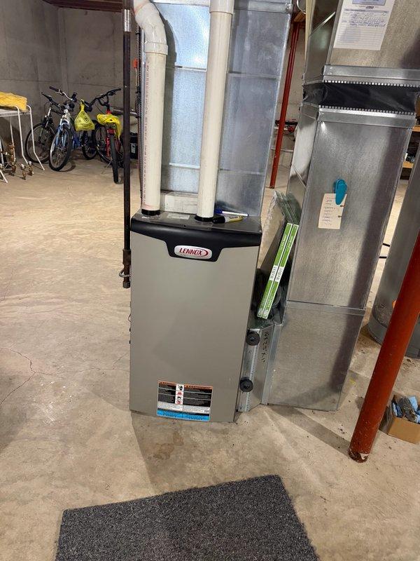 Completed installation of customer-supplied 40-gallon Richmond natural gas water heater in basement utility room. Removed existing unit, installed new water heater with proper venting connections to existing ductwork, connected gas and water supply lines, and tested system for proper operation and safety compliance.