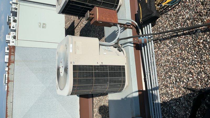 Performed AC tune-up on rooftop unit with R22 refrigerant system. Replaced air filter and inspected blower motor, both operating within normal parameters. Discovered failed capacitor reading overload (OL) during diagnostic testing. Replaced defective capacitor, restoring unit operation. Verified refrigerant charge levels and delta-t measurements, confirming system is operating efficiently and ready for cooling season.