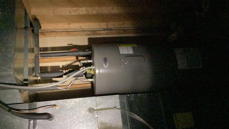 Completed comprehensive plumbing inspection of residential property. Inspected bathroom fixtures including sink, faucet assembly with dual cross-handle controls, and drain system, confirming proper operation and no visible leaks. Evaluated mechanical room plumbing connections, copper supply lines, and utility area installations to ensure compliance with plumbing standards and verify system integrity.