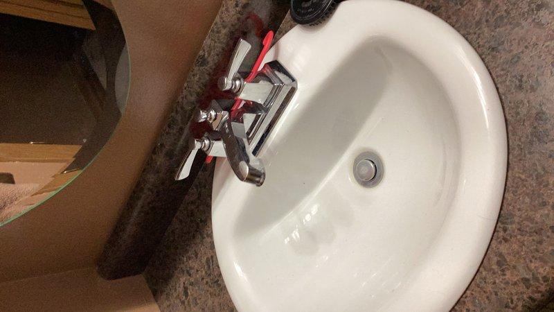 Completed comprehensive plumbing inspection of residential property. Inspected bathroom fixtures including sink, faucet assembly with dual cross-handle controls, and drain system, confirming proper operation and no visible leaks. Evaluated mechanical room plumbing connections, copper supply lines, and utility area installations to ensure compliance with plumbing standards and verify system integrity.
