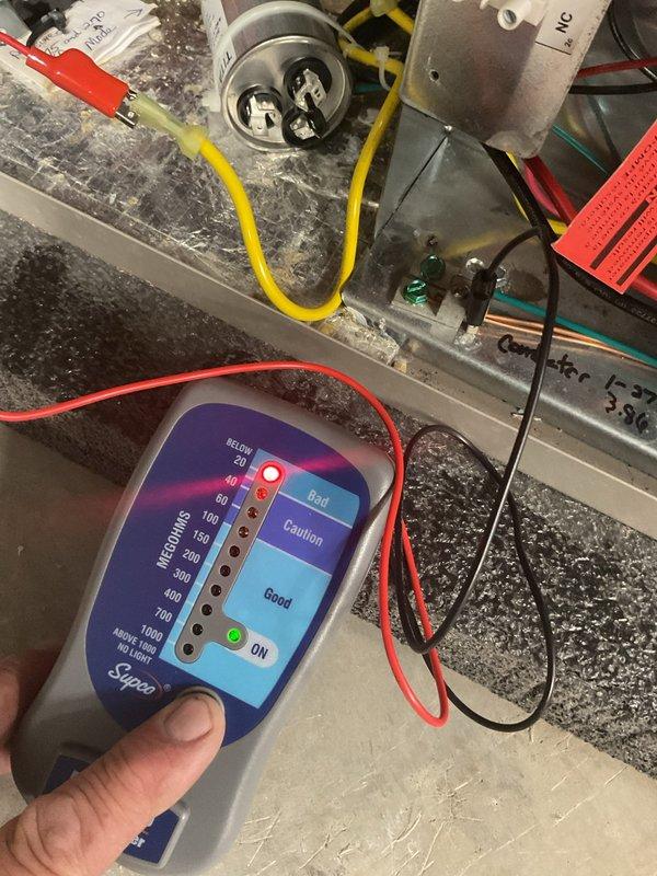 Responded to no cooling complaint on geothermal system producing lukewarm air with second stage cooling inoperative. Performed diagnostic testing using megohm meter on compressor and electrical components. Testing confirmed compressor failure due to electrical short circuit. Coordinated with sales team to schedule consultation for system replacement options including geothermal, air source heat pump, and standard air conditioning equipment.