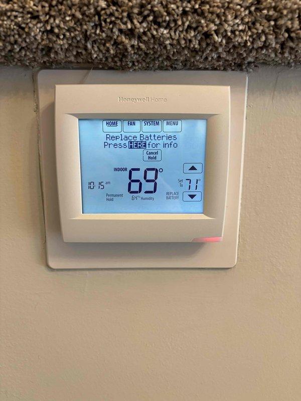 Performed comprehensive AC maintenance on single condenser unit with R-410A refrigerant in 71-degree ambient conditions. Conducted full system inspection including filter, thermostat, temperature split, condenser, coils, motors, capacitors, compressor, refrigerant level, and condensate drain. Identified and resolved low battery condition on Honeywell Home digital thermostat by replacing batteries. Corrected blower speed setting from low to high per factory specifications. All system components tested and verified operating within normal parameters upon completion.