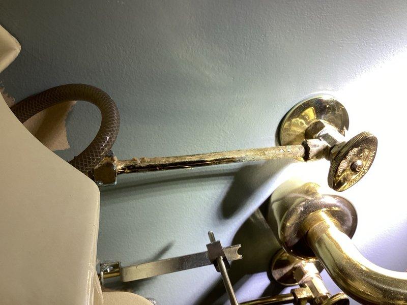 Responded to multiple plumbing issues affecting two bathrooms. Addressed toilet leak causing water damage to downstairs ceiling by installing new toilet with proper wax ring seal and supply line connections. Cleared clogged shower drain in master bathroom affected by significant calcium buildup and mineral deposits. Inspected corroded shower arm assembly showing extensive rust, pitting, and oxidation damage to chrome fixtures. Replaced leaking PEX water supply lines under pedestal sink in half bathroom, installing new shut-off valves and flexible connectors to eliminate leak at connection points. Tested all repairs for proper water flow and verified no active leaks present upon completion.