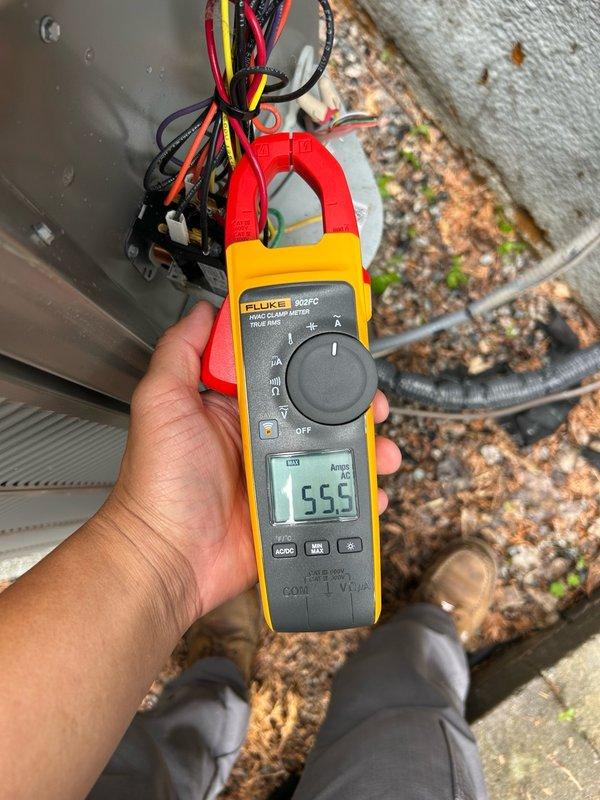Completed comprehensive air conditioning tune-up and maintenance inspection on residential HVAC system. Performed thorough evaluation of thermostat operation, air filter condition, blower assembly, outdoor condenser coil, electrical components including contactor and capacitor, condensate drain system, refrigerant charge levels, and temperature differential across the evaporator coil. All operational parameters measured within manufacturer specifications with amperage readings at 5.55 amps, confirming proper system performance. No mechanical defects, refrigerant leaks, or safety concerns identified during inspection. Outdoor condenser coils showed moderate dust and debris accumulation on fins but system operating efficiently. Advised homeowner on importance of regular filter replacement and keeping indoor/outdoor coils clean to maintain optimal performance and prevent future system issues.
