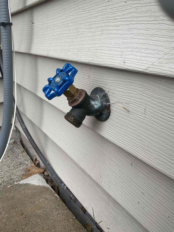 Rebuilt outdoor hose bibb assembly up to 3/4" with adapter (non-freeze proof configuration) to restore proper water flow and control at exterior spigot location. Accessed plumbing through closed wall, requiring opening of interior wall cavity to reach supply lines. Installed new ball valve up to 1" on copper supply line in ceiling joist space to provide improved shutoff capability for the exterior fixture. Replaced corroded spigot hardware and rebuilt valve assembly to eliminate leaks and restore full operational function. All connections tested and verified for proper operation with no leaks detected at valve body, threaded connections, or wall penetration points.