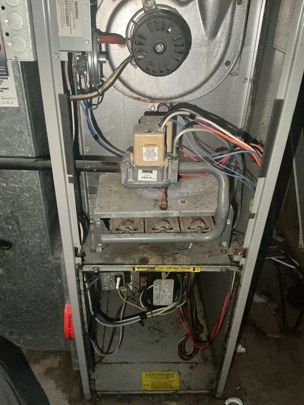 Responded to no cooling call on 32-year-old HVAC system containing obsolete R22 refrigerant. Upon inspection, discovered indoor evaporator coil actively leaking water, failed control board causing intermittent blower motor operation, cracked heat exchanger rendering furnace unsafe for operation, and severely deteriorated outdoor condenser coil. Documented all failed components with photos including borescope inspection of compromised heat exchanger. Due to multiple critical failures, age of equipment, and safety concerns, system was deemed beyond economical repair. Coordinated same-day replacement estimate for complete furnace and air conditioning system installation.