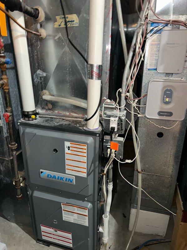 Completed annual cooling system maintenance and tune-up on Daikin HVAC system. Performed comprehensive inspection including thermostat calibration, air filter evaluation, blower assembly examination, outdoor coil assessment, electrical component testing, contactor and capacitor verification, condensate drain check, refrigerant charge analysis, and temperature split measurements. Investigated noise concern reported by neighbor regarding outdoor unit operation. All system parameters measured within manufacturer specifications with no mechanical defects, refrigerant issues, or safety hazards identified. System confirmed operating efficiently and properly. Recommended continued regular filter replacement and coil maintenance to ensure optimal performance and system longevity.