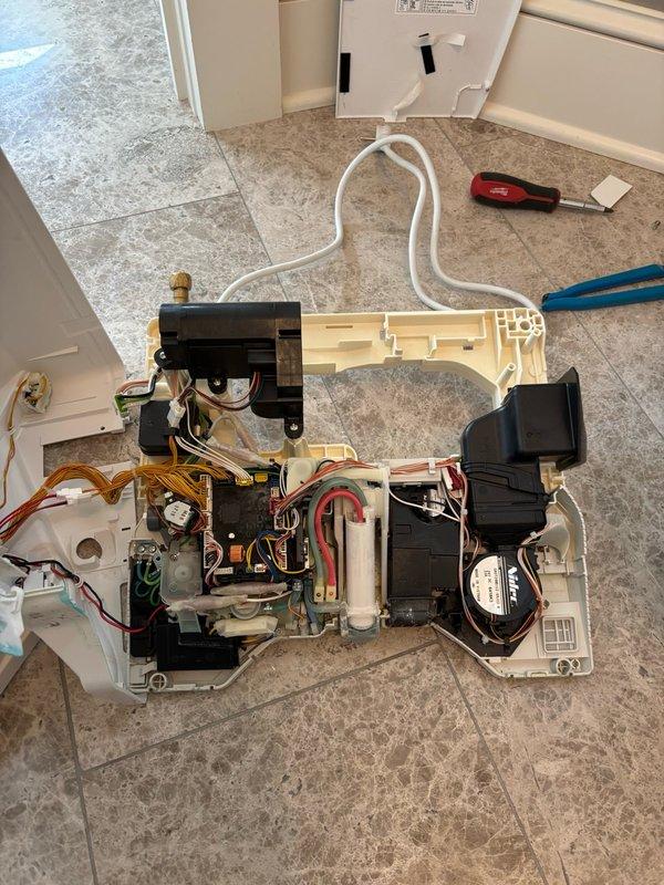 Responded to service call for malfunctioning Toto Neorest 550H electronic toilet experiencing multiple issues including unit malfunction, clicking noises, water leakage, and electrical circuit tripping. Performed diagnostic assessment of the unit and contacted Toto technical support to troubleshoot the problem. Determined that replacement parts are required to complete the repair and confirmed parts order has been placed and will be delivered to the shop. Service visit concluded with diagnosis complete; follow-up appointment will be scheduled upon parts arrival to complete the necessary repairs and restore unit to proper working condition.