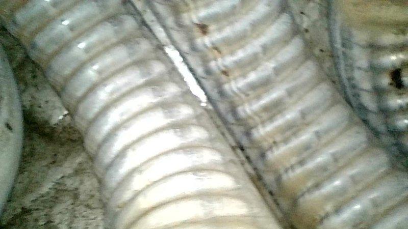 Responded to a no-cooling call on a 2000 Nordyne furnace and air conditioning system. Upon arrival, found equipment located in basement accessed via trap door with standing water, heavy insect activity, and strong sewage odor creating unsafe and unsanitary working conditions. Furnace was powered off at service switch and evaporator coil access panel had been previously removed. Restored power to system and observed control board displaying two flashing LEDs with no identifiable fault pattern. System remained non-responsive with indoor blower failing to energize and outdoor condensing unit not starting despite thermostat call for cooling. Initial inspection revealed critically low refrigerant levels and equipment in severely deteriorated condition. Due to hazardous work environment including sewage contamination and insect infestation, full diagnostic procedures could not be safely completed. Attempted to contact property owner to report conditions but received no response. Documented c