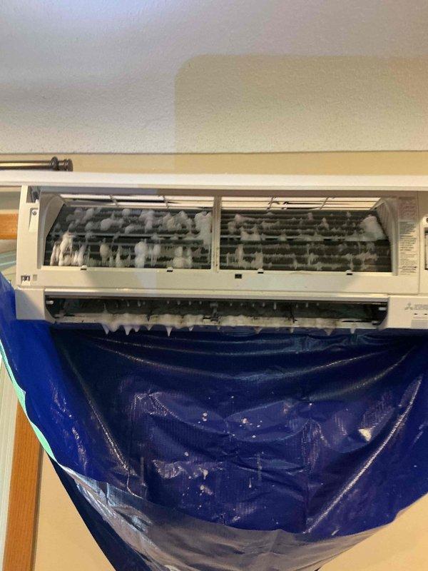 Responded to service call for ductless mini-split system maintenance. Performed comprehensive cleaning of blower wheel assembly on indoor unit, which had accumulated significant buildup affecting system performance. Thoroughly cleaned both indoor evaporator coils and outdoor condenser unit to restore proper airflow and heat exchange efficiency. Utilized protective collection tarp during service to contain water and debris. Verified electrical connections at service disconnect panel and confirmed all circuit breakers were properly functioning. System tested and returned to full operation with improved airflow and cooling capacity.