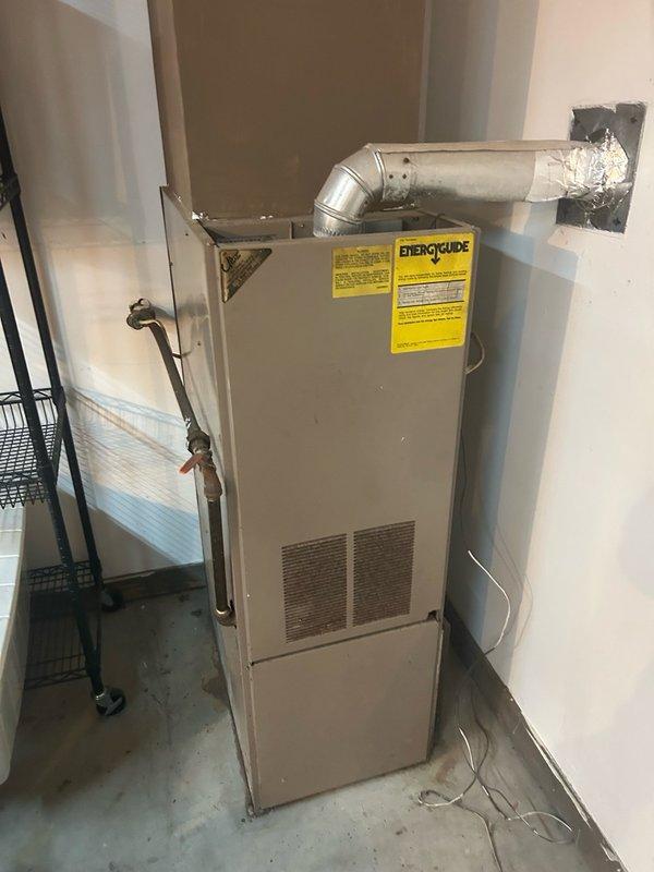 Performed comprehensive furnace inspection and tune-up on forced air heating system. Upon inspection, discovered critical safety hazard: cracked flue pipe with carbon monoxide levels exceeding 500 ppm. Verified gas manifold pressure within manufacturer specifications. Air filter and blower motor condition satisfactory, though blower wheel exhibited rust and dirt accumulation requiring attention.

Heat exchanger inspection limited by restricted access, but visible areas showed significant soot, rust, and corrosion buildup indicating potential compromised integrity. During operational testing, observed abnormal safety control behavior—circulating blower energized within 30 seconds then shut off while burner flame remained active and rolling, indicating potential limit switch malfunction or heat exchanger failure.

Due to dangerous carbon monoxide levels and unsafe operating conditions posing immediate health and safety risk, shut off gas supply to unit and red-tagged system as unsafe for