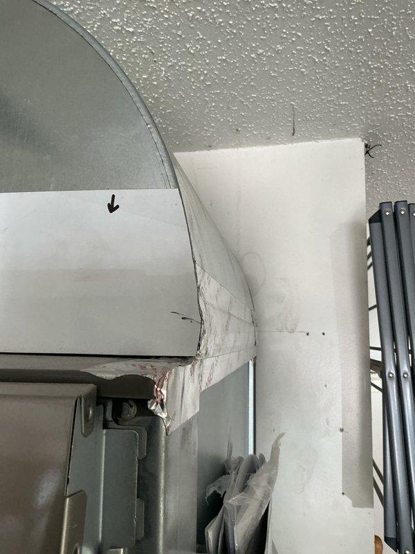 Installed a proper P-trap on the HVAC condensate drain line to replace the temporary drainage setup. The condensate line was previously running directly to the drain without appropriate trap configuration. Completed installation of code-compliant P-trap assembly using white PVC piping with proper fittings to ensure adequate drainage and prevent air infiltration into the system.