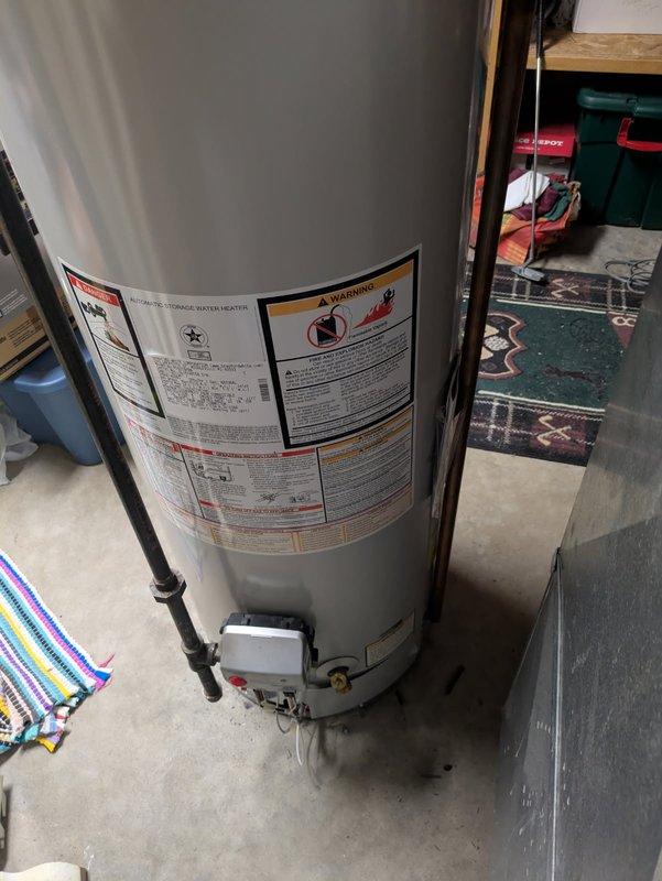 Responded to service call to inspect water heater gas valve. Upon arrival, accessed unit in basement utility area and performed visual inspection of Honeywell gas control valve assembly. Documented existing gas valve with detailed photographs showing model specifications, temperature settings, pilot light controls, and connection points to ensure accurate replacement part ordering. Transmitted images to parts department for proper gas valve identification and procurement.