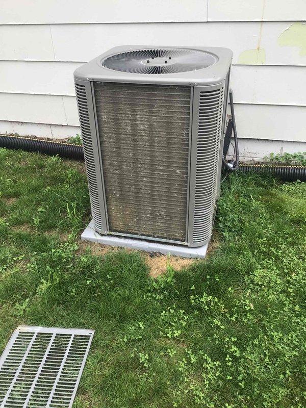 Completed comprehensive AC tune-up on 2-year-old system under maintenance agreement. Performed outdoor condenser cleaning to remove accumulated dirt and debris from coil fins, conducted full electrical testing with all measurements within manufacturer specifications, and replaced air filter. System demonstrated proper operation with 20-degree temperature split across evaporator coil, confirming optimal cooling performance.