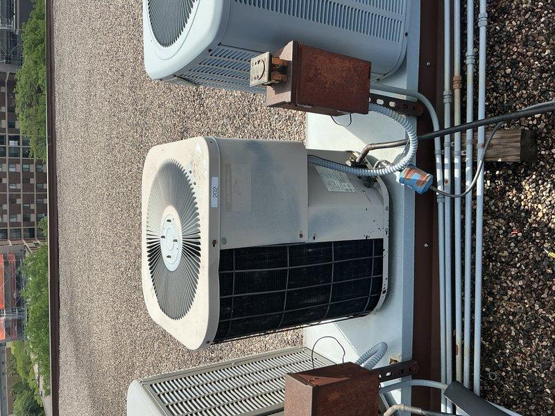 Completed comprehensive AC tune-up on rooftop R22 refrigerant system. Replaced 20x20x1 air filter, inspected blower motor and all electrical wiring with satisfactory results. Verified capacitor functionality and refrigerant charge levels within acceptable parameters. Noted contactor showing significant wear and deterioration but remains operational; advised building owner of condition for future replacement consideration. Despite age of equipment and visible corrosion on evaporator coil assembly, system is functioning properly and ready for cooling season.