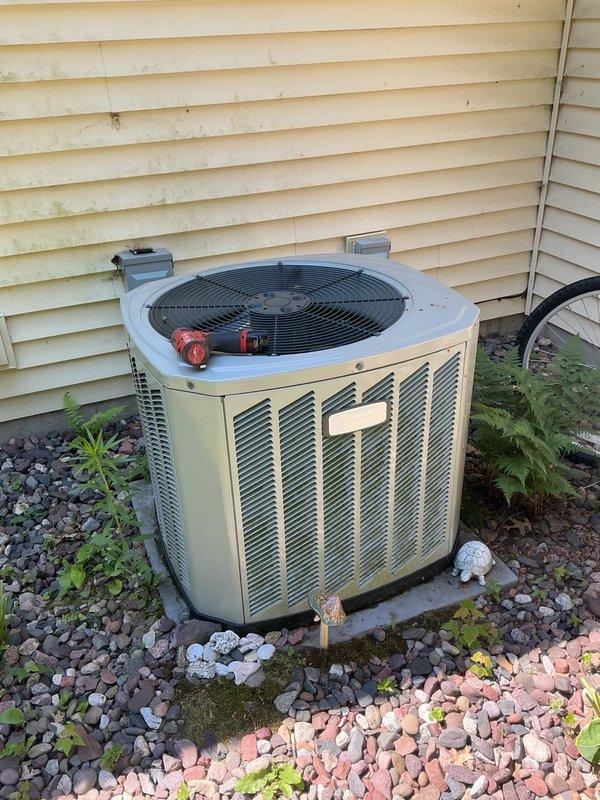 Completed Family Rewards cooling maintenance visit on Lennox HVAC system as part of recurring preventative maintenance agreement. Performed comprehensive air conditioning tune-up inspection prior to property transfer to new owners. Replaced air filter with customer-supplied filter and verified evaporator drain line was flowing properly. Cleaned outdoor condenser coil which showed moderate dirt accumulation. Inspected all electrical connections and components, finding capacitor testing at acceptable levels. System operational check confirmed proper performance with 20-degree temperature split across evaporator coil, indicating adequate cooling capacity and refrigerant charge.