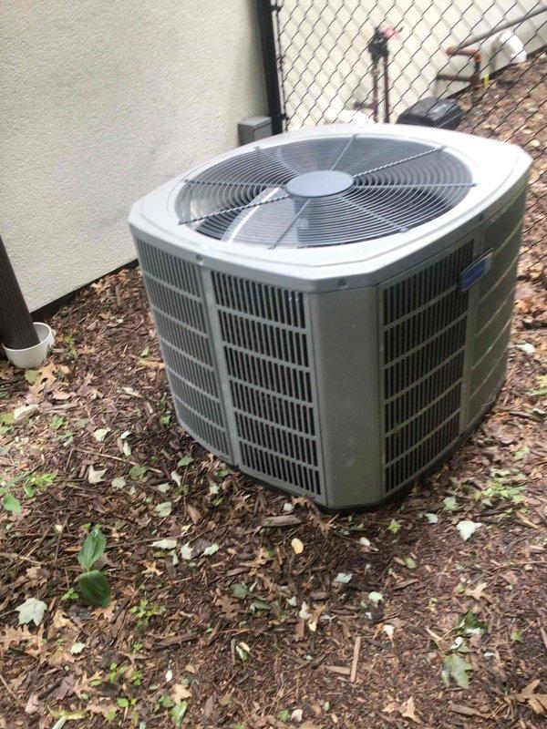 Completed routine AC tune-up on 9-year-old American Standard system with no reported issues. Performed comprehensive maintenance including washing outdoor condenser unit, testing all electrical components which measured within manufacturer specifications, and replacing air filter with customer-provided unit. System operational test confirmed proper performance with 18-degree temperature split across evaporator coil.
