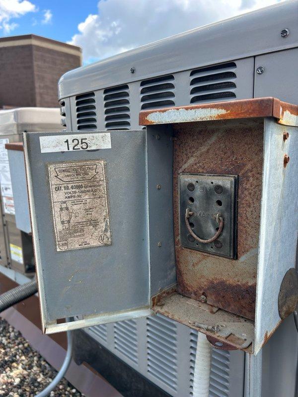 Performed comprehensive AC tune-up on rooftop unit after obtaining roof access from front desk. Conducted thorough maintenance inspection including verification of thermostat operation, 16x20x1 filter condition, blower assembly, outdoor coil cleanliness, electrical components, contactor, capacitor, condensate drain functionality, refrigerant performance, and temperature split measurements. All readings confirmed within normal operating range with no mechanical defects or safety concerns identified. Noted significant rust and corrosion present in electrical disconnect box #125, though system currently operating properly. Recommended continued routine filter changes, maintaining clean indoor and outdoor coils, and scheduling regular preventive maintenance to ensure optimal performance and longevity.