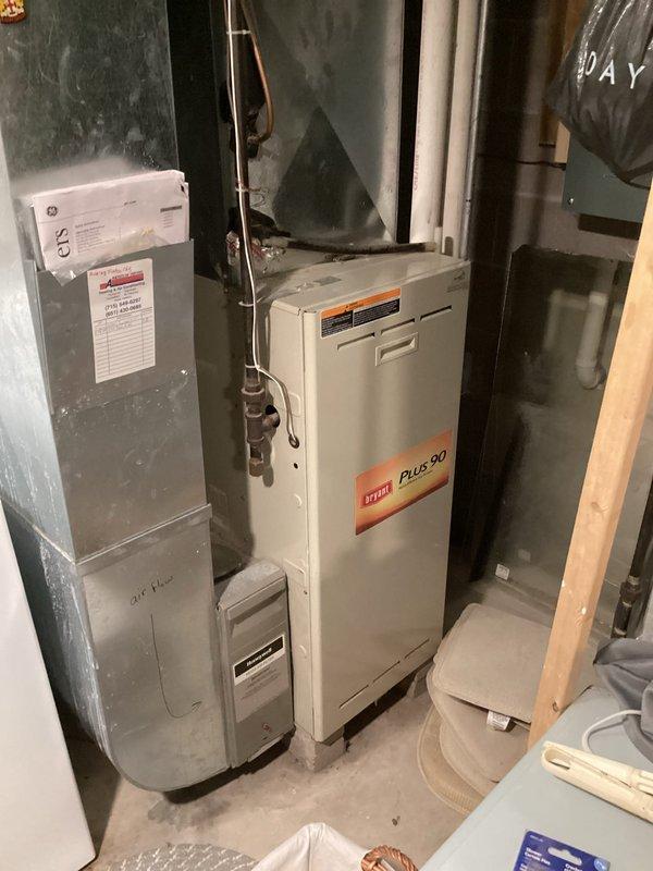 Completed comprehensive AC tune-up and system inspection as part of recurring maintenance agreement. Performed thorough evaluation of cooling system cleanliness, reliability, and operational performance. Verified refrigerant charge levels found to be within acceptable range, however noted compressor drawing higher than normal amperage indicating potential efficiency concerns. System showing signs of age and wear but maintaining functionality under current load conditions.

Conducted complementary furnace inspection on Bryant Plus 90 unit and identified critical safety issue with secondary heat exchanger. Upon detailed examination, determined heat exchanger to be compromised, which poses potential carbon monoxide hazard and requires immediate attention. This model has documented history of heat exchanger failures and current condition confirms need for corrective action.

Unable to complete air filter replacement as filter housing access was restricted; customer will need to install cus